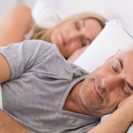 couple-sleeping-in-bed-picture-id531415068